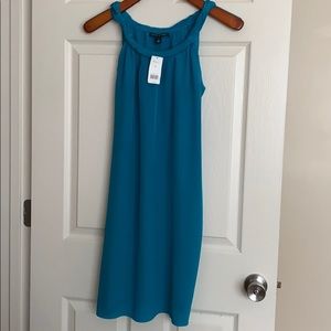 Women’s turquoise silk dress.